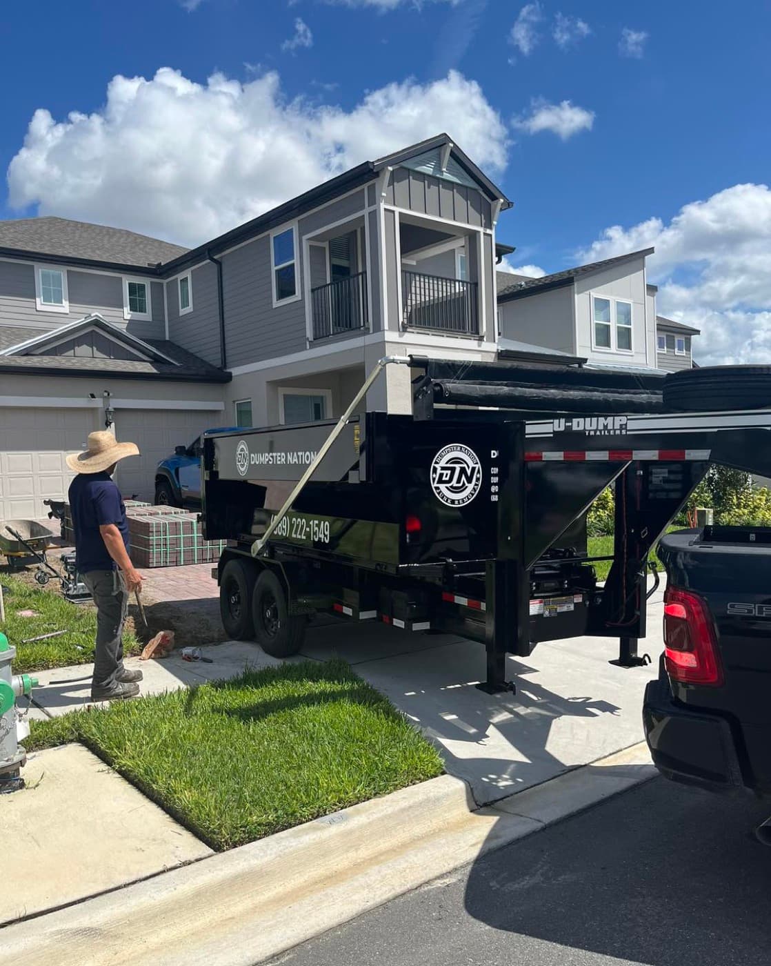 Dumpster Nation JAX delivering a roll-off dumpster to a Jacksonville home